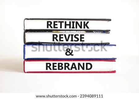 Rethink revise rebrand symbol. Concept word Rethink Revise and Rebrand on beautiful book. Beautiful white table white background. Business brand motivational rethink revise rebrand concept. Copy space