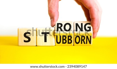 Strong and stubborn symbol. Concept words Strong Stubborn on wooden block. Beautiful yellow table white background. Businessman hand. Business strong and stubborn concept. Copy space. Royalty-Free Stock Photo #2394089147