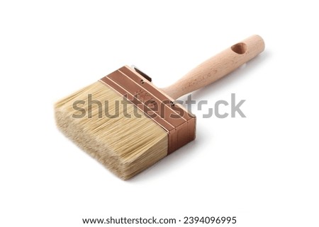Large brush for applying wallpaper paste to the wall Royalty-Free Stock Photo #2394096995