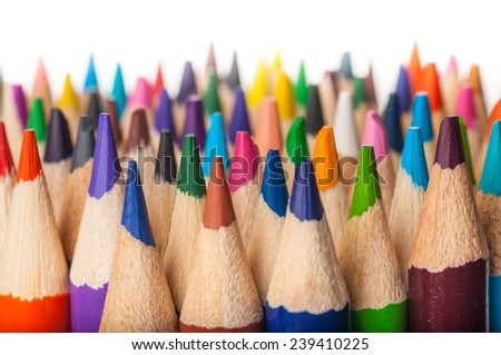 Colored pencil tips with staggered height on white background.