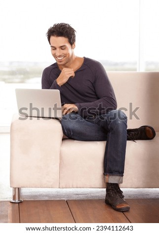 Man, typing and work from home on laptop for graphic design career, planning and research on website and sofa. Startup freelancer or online designer relax on couch with computer and happy project
