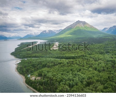 Aerial view of Port Alsworth, Alaska within Lake Clark National Park and Preserve. Private Port Alsworth Airport, public Wilder Natwick Airport, Tanalian Mountain, Chig­mit Mountains, Hardenburg bay. Royalty-Free Stock Photo #2394136603