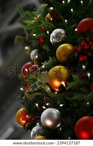 Close up photo of a decorated Christmas tree in the city	