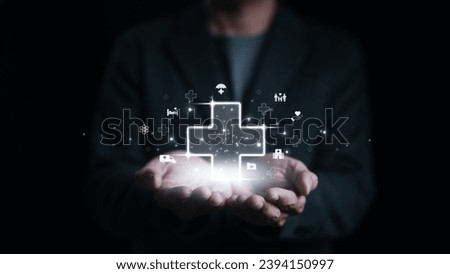 Businessman holding virtual plus sign and medical icons for positive thinking mindset or healthcare insurance symbol concept. Mental care, Health insurance, Work welfare, Employee health protection,