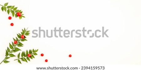 Merry Christmas and Happy Holidays greeting card, banner. White background with decoration ornaments red and green. New Year. Flat lay. With copy space 