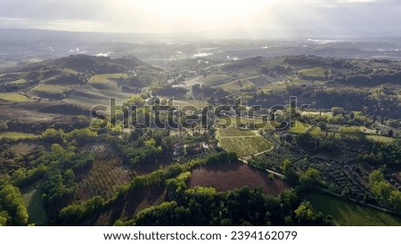 Aerial view of rural landscape Tuscany, travel video over the farms Royalty-Free Stock Photo #2394162079