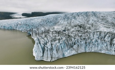 Aerial view of white glacier. Epic Drone Shot iceberg