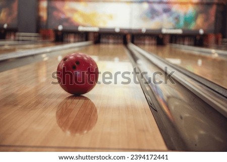 Modern bowling room waiting for visitors, balls on bowling alley