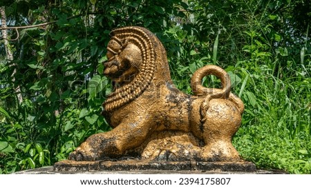 Golden Lion Chinese lion sculpture , scene surrounded by green lawns