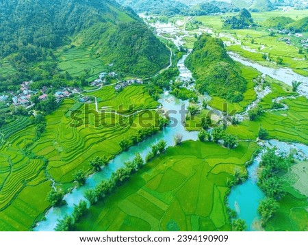 Aerial landscape in Quay Son river, Trung Khanh, Cao Bang, Vietnam with nature, green rice fields and rustic indigenous houses. Near Ban Gioc Waterfall. Travel and landscape concept.