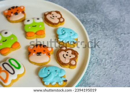 Homemade of colorful cookies with shaped as cute face of animal cartoon character