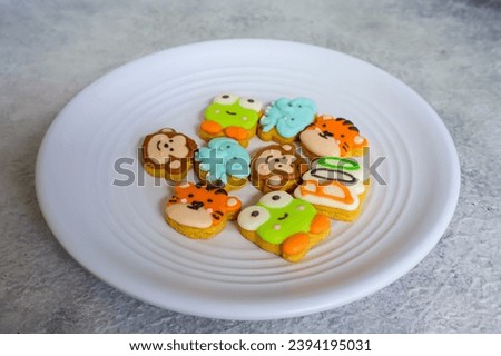 Homemade of colorful cookies with shaped as cute face of animal cartoon character