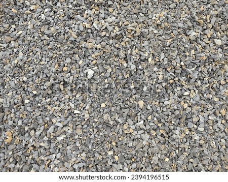 Gravel stone background, dark gravel pebbles stone texture seamless texture Royalty-Free Stock Photo #2394196515