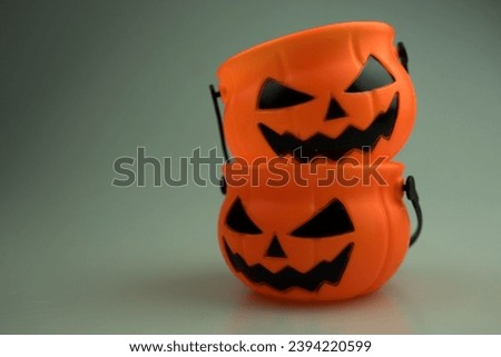 Pumpkin basket for kid collecting candy, trick or treat on Halloween day celebration