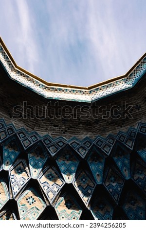 A close-up view of the intricate details of traditional Iranian architecture, revealing the artistry and craftsmanship of the architects. The details are a combination of symmetry, geometry, and curve