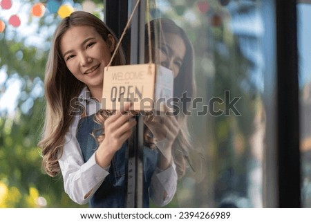 Welcome, open shop barista waitress open sign on glass door modern coffee shop ready to serve restaurant cafe, retail small business owners.
