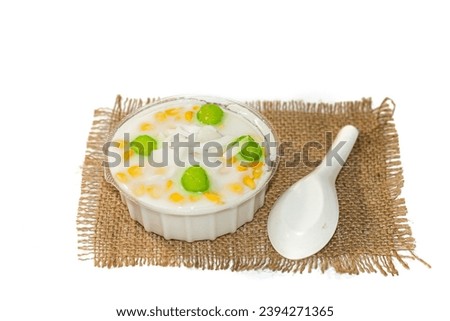 Dessert of Thailand put on sack with isolated picture style serving with coconut slices put on top.