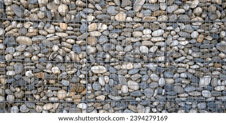 stones textured fence gabion steel metal grated stone wall basket made of mesh and stones background stone and gravel enclosed in metal cage to create wall and facade