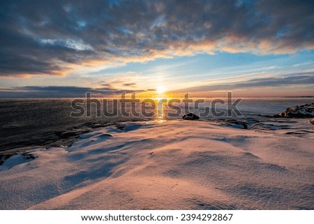 The coast of the Gulf of Finland in winter at sunset Royalty-Free Stock Photo #2394292867