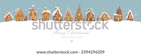 Christmas greeting card with cute gingerbread houses on mint color background with snowflakes. Vector illustration with christmas village and snowfall. Royalty-Free Stock Photo #2394296209