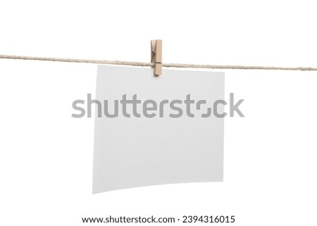 White blank card with on rope isolated on white background.  Image taken with tilt-shift lens for perspective control      