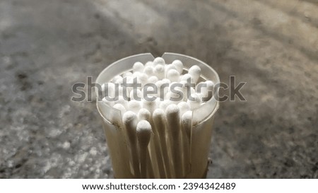 White cotton buds with an abstract background.