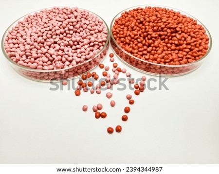 polymer masterbatch granules in a petri dish isolated on a white background suitable for banner design for profile photos of plastic company catalogues