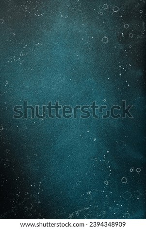 Blue textured aged stone background. Top view. On a dark background. Free space for text.