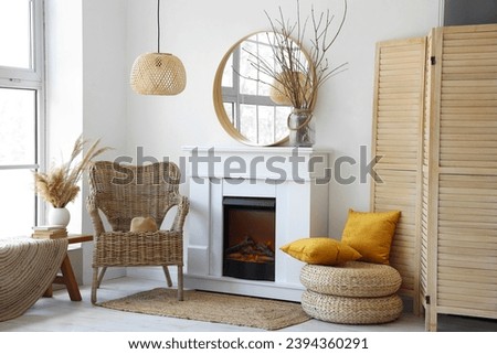 Interior of modern living room with stylish fireplace