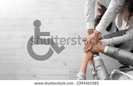 Inclusive workplace culture, banner design. International symbol of access. People holding hands together, top view