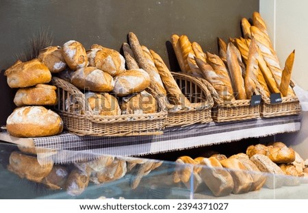 Assorted fresh bread on counter in European bakery