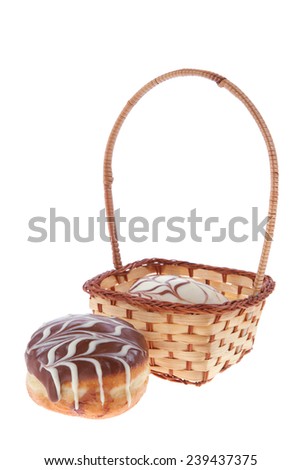traditional jewish holiday chanuka donuts covered by dark and white chocolate pattern on retro vintage basket isolated on white background