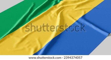 Flag of Gabon. Fabric textured Gabon flag isolated on white background.