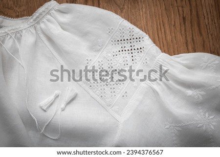 White women's hand-made Ukrainian embroidered shirt Royalty-Free Stock Photo #2394376567