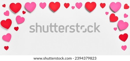Many paper hearts on light background with space for text. Valentine's Day celebration