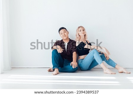 a couple sits on the floor of dancers in love in relaxation