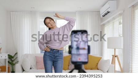 Asia vlogger woman influencer smile enjoy hobby happy fun live online screen  reel  at home Gen Z teen girl talent people play video selfie camera shoot  app show share viral story Royalty-Free Stock Photo #2394395253