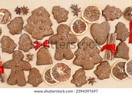 Christmas gingerbread cookies or biscuits on baking paper background. Top view minimal pattern, aesthetic flat lay from homemade festive sweet food, traditional bakery different shapes, new year decor