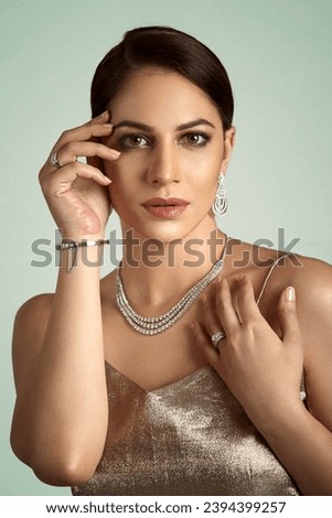 Beautiful Indian model wearing a diamond necklace  Royalty-Free Stock Photo #2394399257