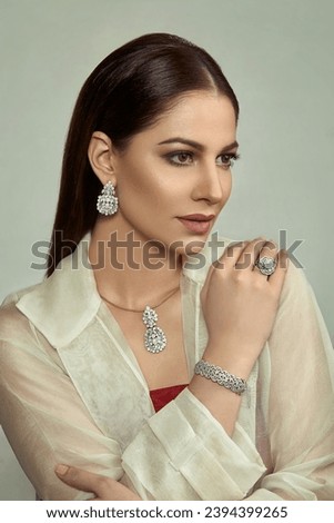 Beautiful Indian model wearing a diamond necklace  Royalty-Free Stock Photo #2394399265