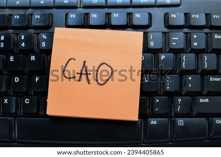 Concept of CAO write on sticky notes isolated on keyboard.