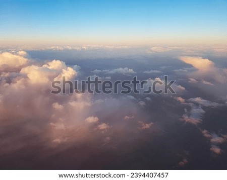 view of sky and clouds - The view of the sky and the pattern of clouds during the flight (Golden Time) from the airplane window
