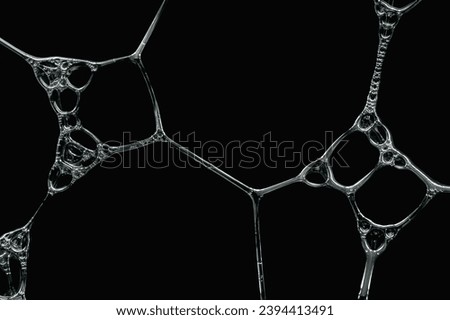 Close-up of soap foam bubbles on a black background