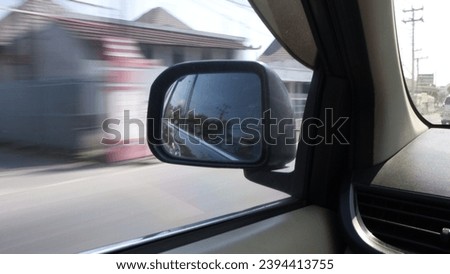 Car side mirrors, an important part of the car. The photo was taken with a low shutter speed and motion blur