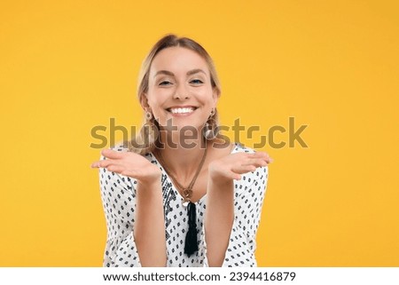 Portrait of smiling hippie woman on yellow background