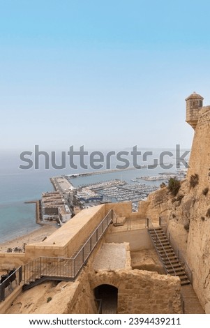 View from Santa Barbara castle on port and marina of Alicante, Costa Blanca Spain. Mediterranean sea, view from above, view on marina bay, buildings, and sea shore, panoramic view with coast line.