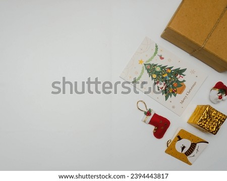 Christmas elements isolated on a white background, with a holiday greeting card with a picture of a snowman and a holiday greeting card with a picture of a christmas tree. Christmas ornaments with gre