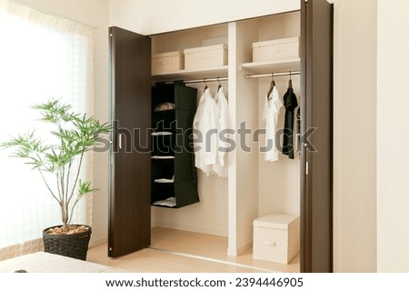 Closet space in newly built bedroom Royalty-Free Stock Photo #2394446905