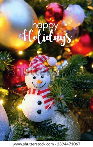 Happy holidays greeting card. Christmas background. cute snowman and festive decorations on christmas tree. New Year, Christmas holidays. winter season concept