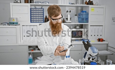 Intriguing redhead scientist, young man takes passionate notes, connecting science, medicine in cozy indoor lab, sporting beard, glasses enhancing handsome features while ensuring safety